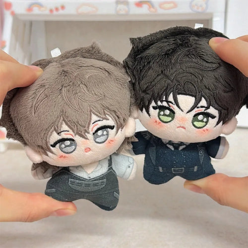 The provided image does not feature mushroom products or adaptogens; it depicts two small anime-style plush dolls.