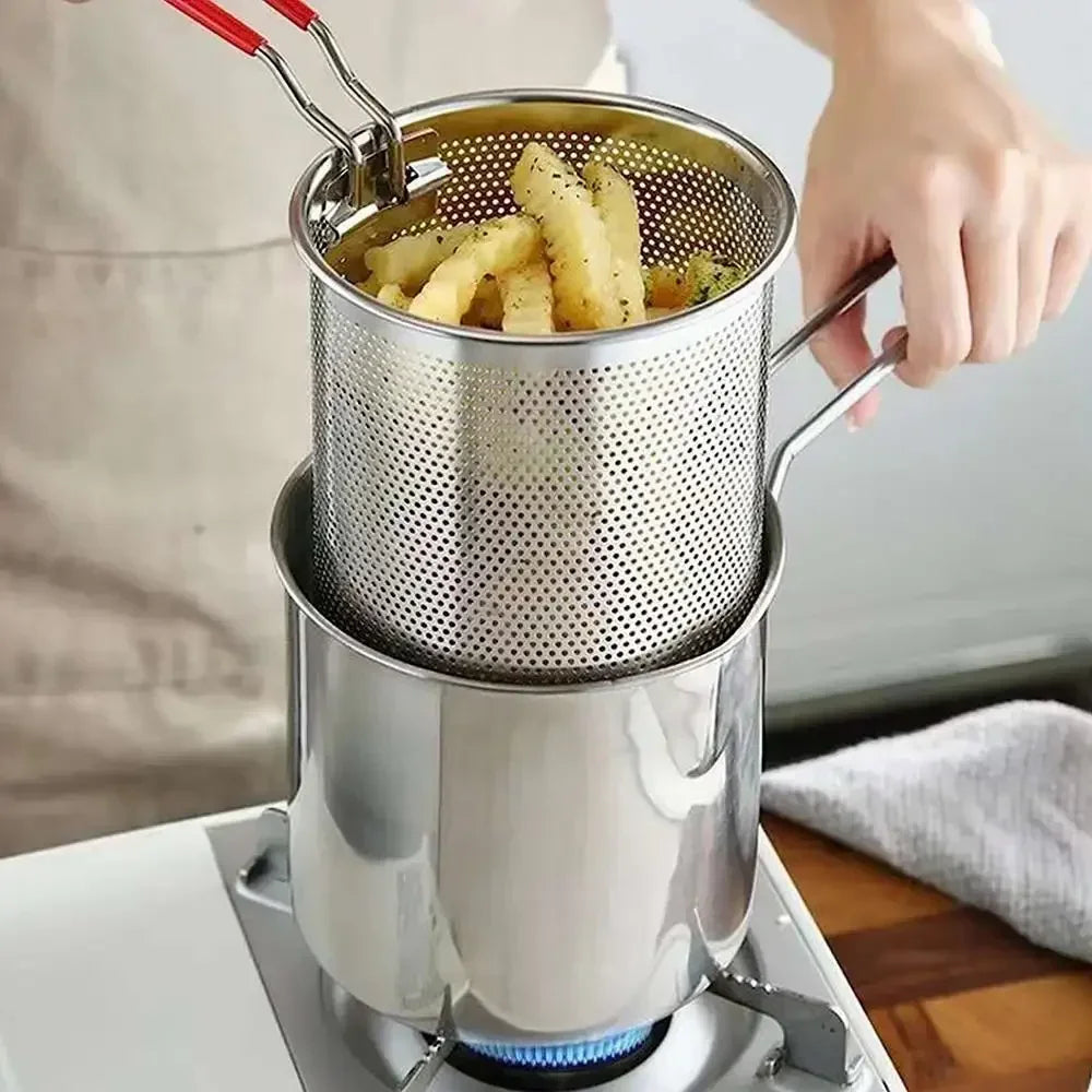 Stainless steel deep fryer with perforated basket and red handles for lifting fries