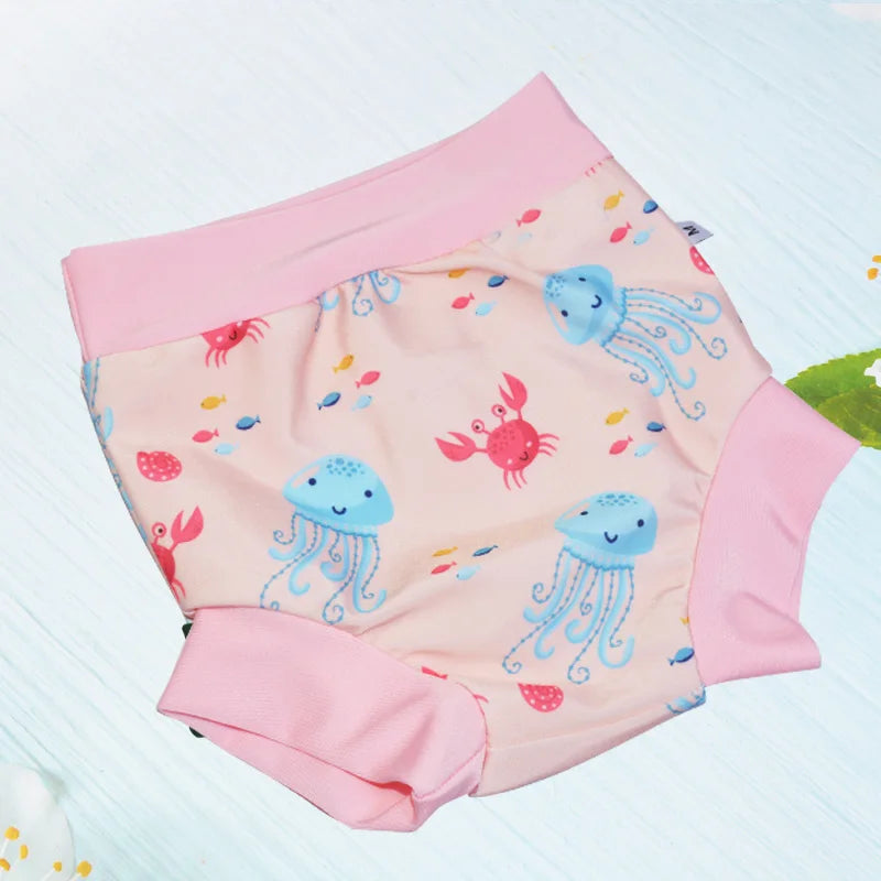 Size M baby swim diaper with cute pink, blue jellyfish, and crab ocean print for infant pool care.