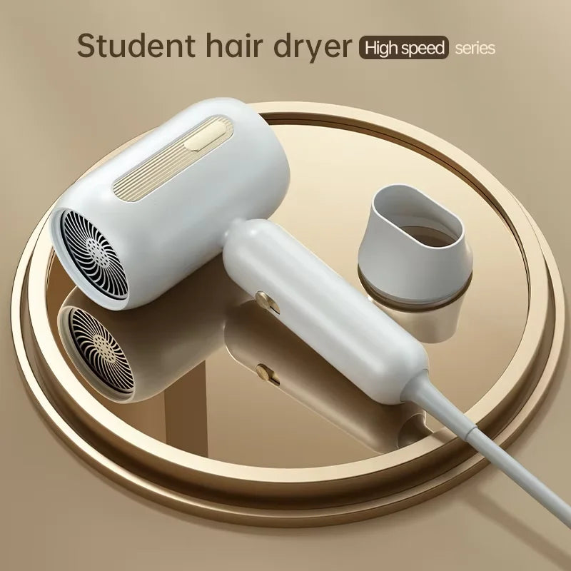 F41 white high-speed hair dryer with gold accents, nozzle attachment, and sleek modern design for quick, quiet drying.