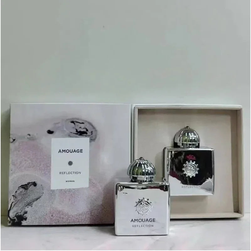 Amouage Reflection Woman EDP: Luxury metallic square bottle and gift box, Arabian floral woody fragrance for women.