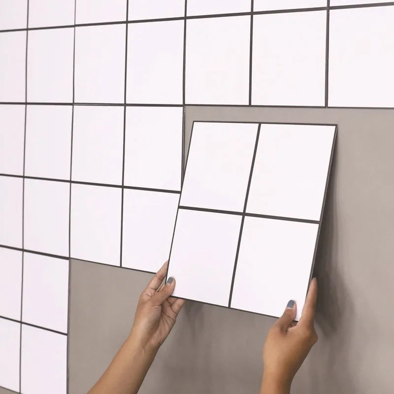 Marble-style square peel-and-stick backsplash tiles, white with light gray veining (12 in x 12 in).