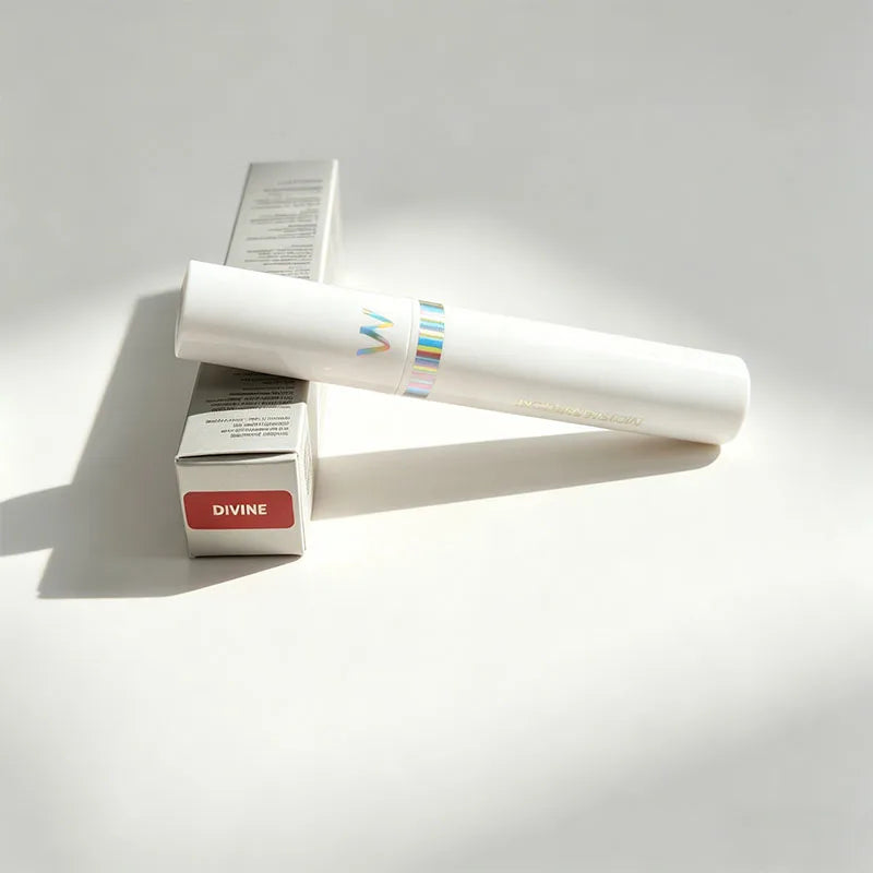 Wonderskin peel-off lip stain in Divine, long-lasting waterproof pink tint with white applicator and retail box.