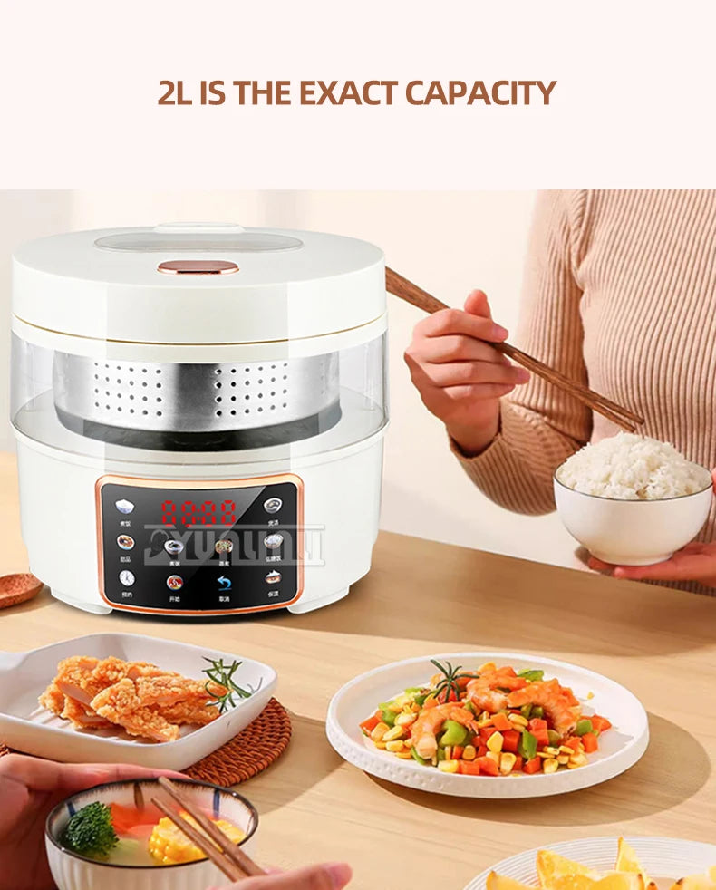 White 2L rice cooker on table with person serving food from bowl