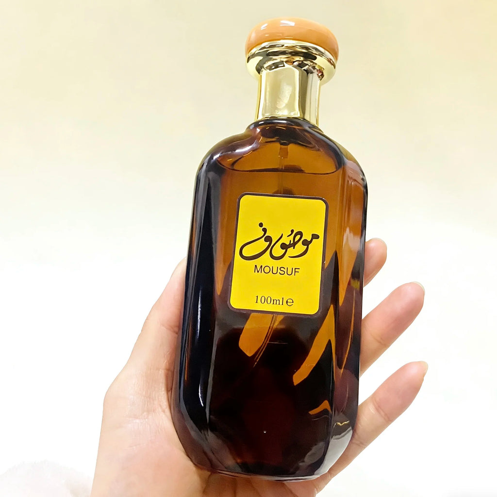 Mousuf Intense 100ml EDP: Unisex Arabian sweet musk perfume in a rectangular brown glass bottle with gold cap.