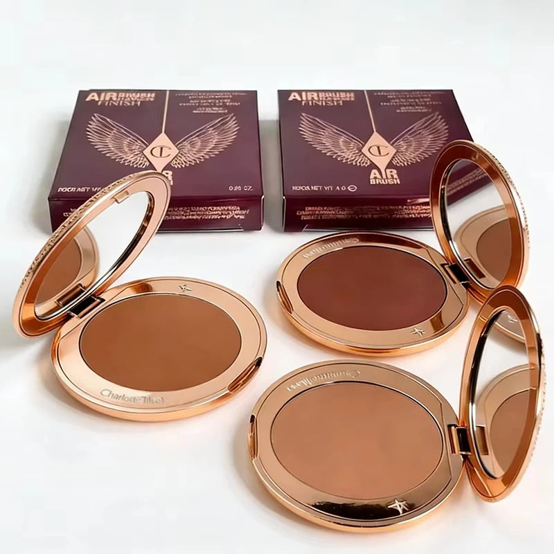Charlotte Tilbury Airbrush Flawless Finish powder compacts in gold packaging with mirror and matte finish bronzer shades.