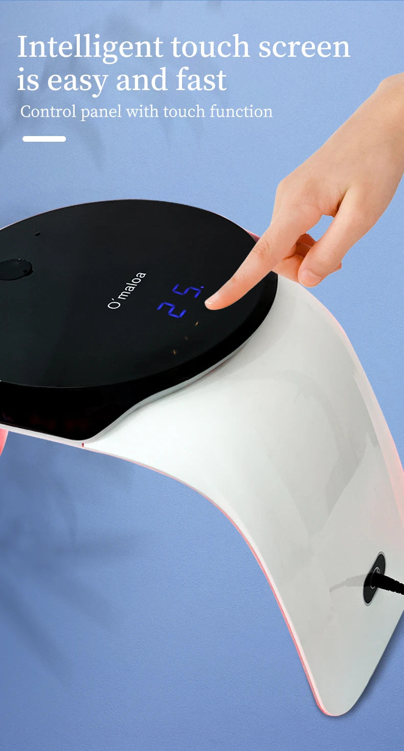 Hand touching the black, arched digital control panel of a white LED nail lamp.