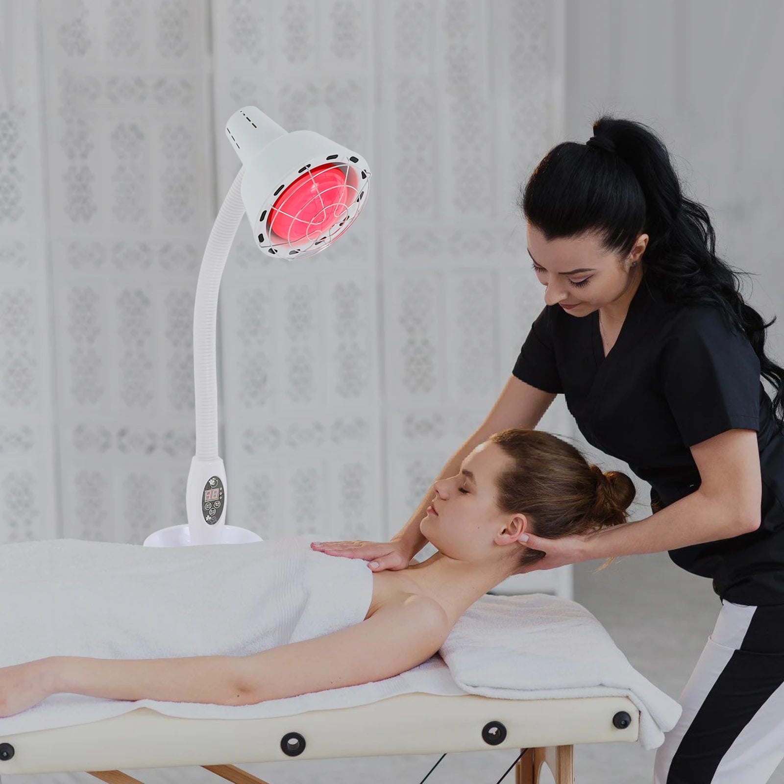275W infrared heat therapy lamp with adjustable neck and timer, used for muscle pain relief during a massage session.