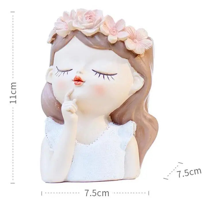 Girl-face succulent planter with closed eyes and pink flower crown