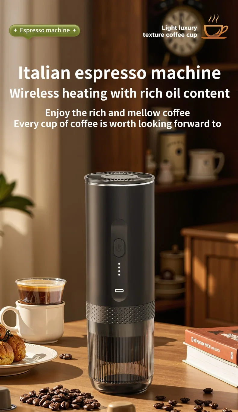 Portable black Italian wireless espresso machine with a sleek cylindrical design on a wooden table.