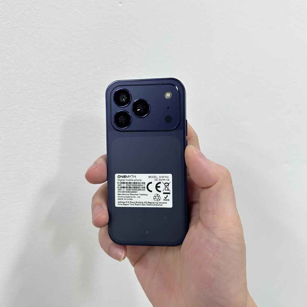 ONEMYTH A18 Pro 4G mini smartphone, blue back view, held in hand, showing triple camera design and device info label.