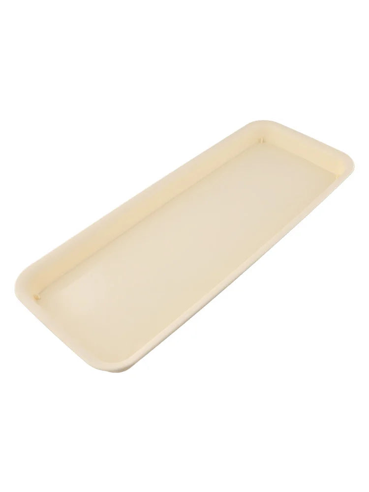 Beige rectangular plastic plant water tray, top view, rounded corners and smooth interior
