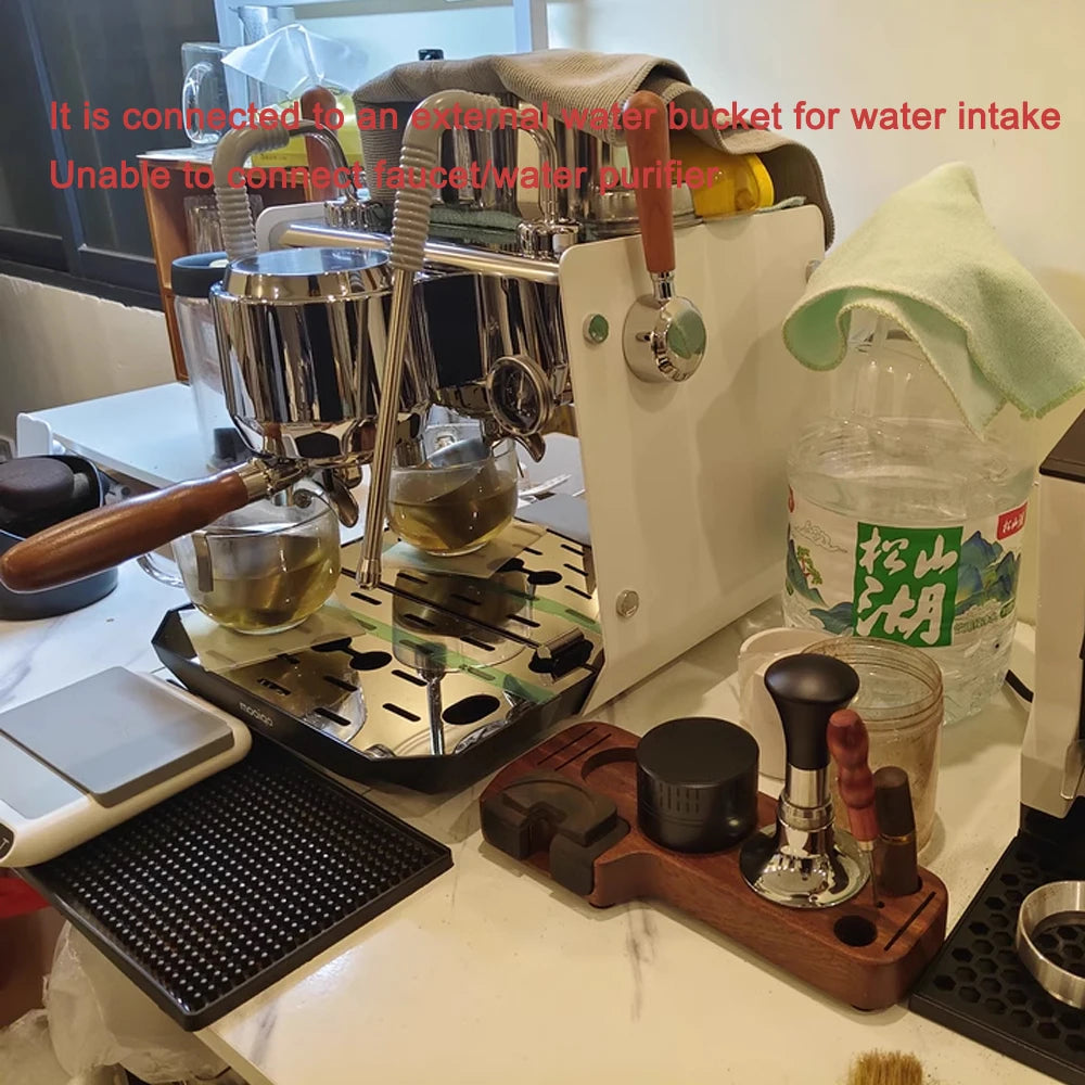 White Mociao espresso machine with chrome accents, wooden handle, and external water bottle setup on a coffee station.
