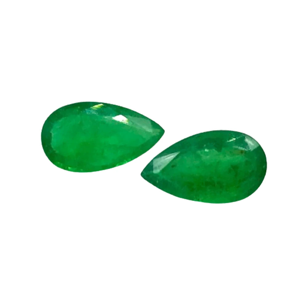 Pair of green teardrop gemstone cabochons with glossy shine