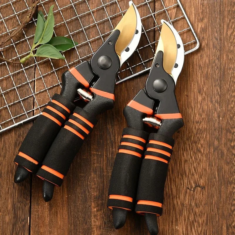 Pruning shears pair with black grips and orange bands, curved yellow blades on mesh
