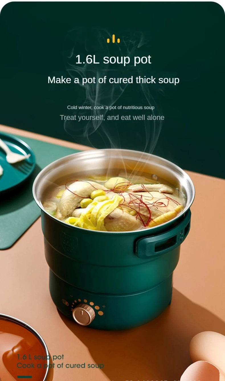 1.6L green electric soup pot with lid, filled with thick broth and noodles