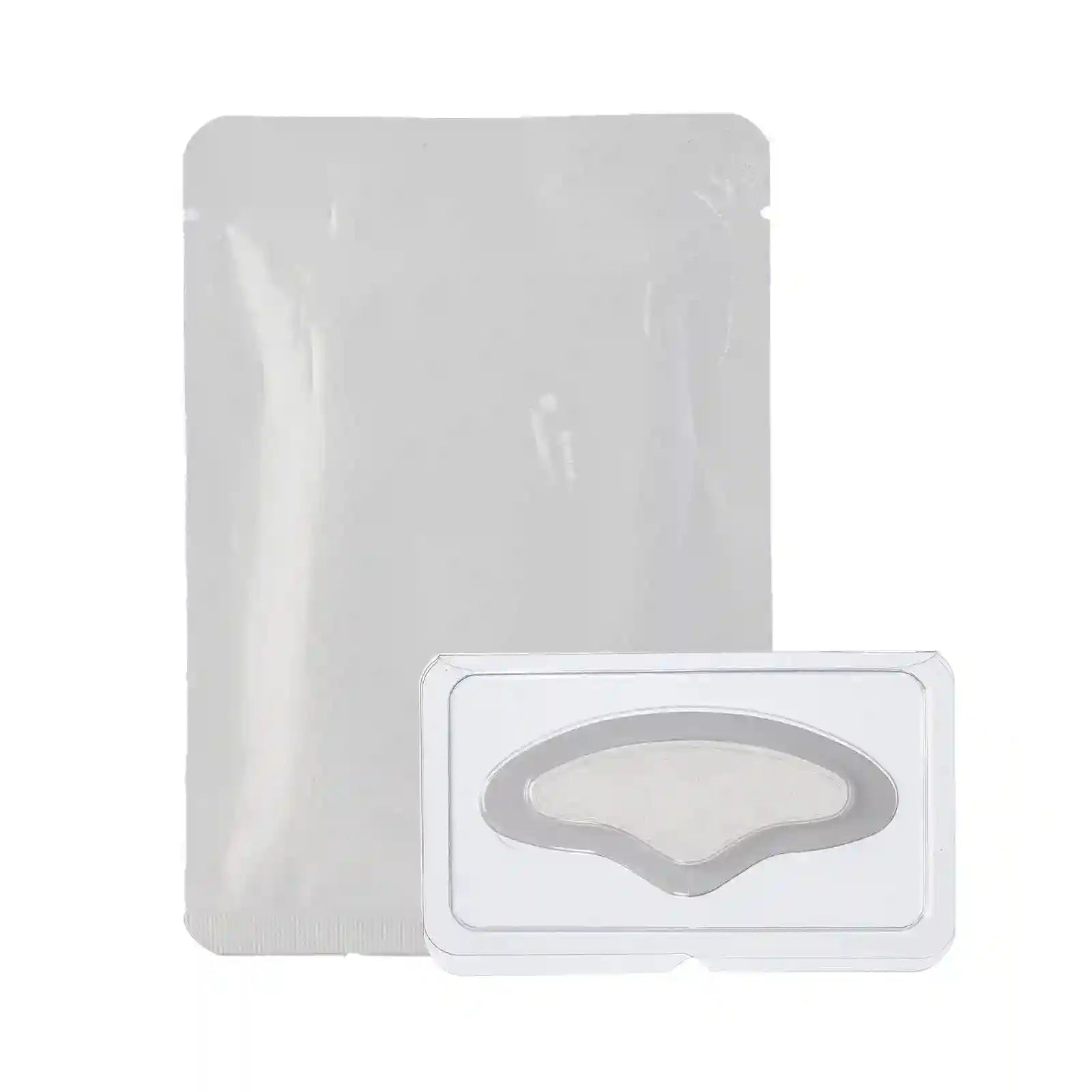 A white rectangular sachet beside a clear blister pack containing a single, curved, translucent microneedle patch.