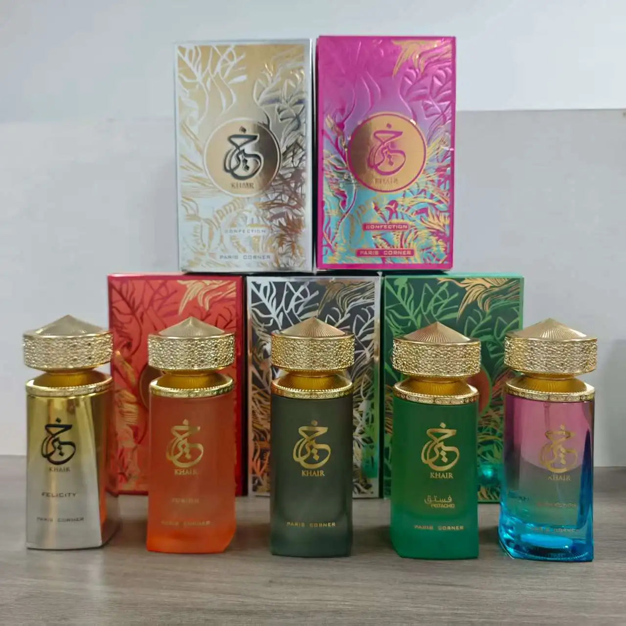 Paris Corner Khair EDP collection: luxurious cylindrical bottles with gold caps. Women’s perfume set, 3.4 oz fragrances.