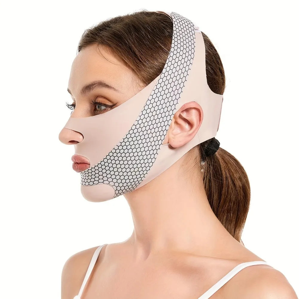 Woman wearing a beige, honeycomb-textured facial slimming bandage around her chin, jaw, and head.