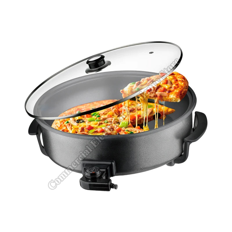 Electric non-stick hot pot with clear glass lid and handles, pizza cooking inside.