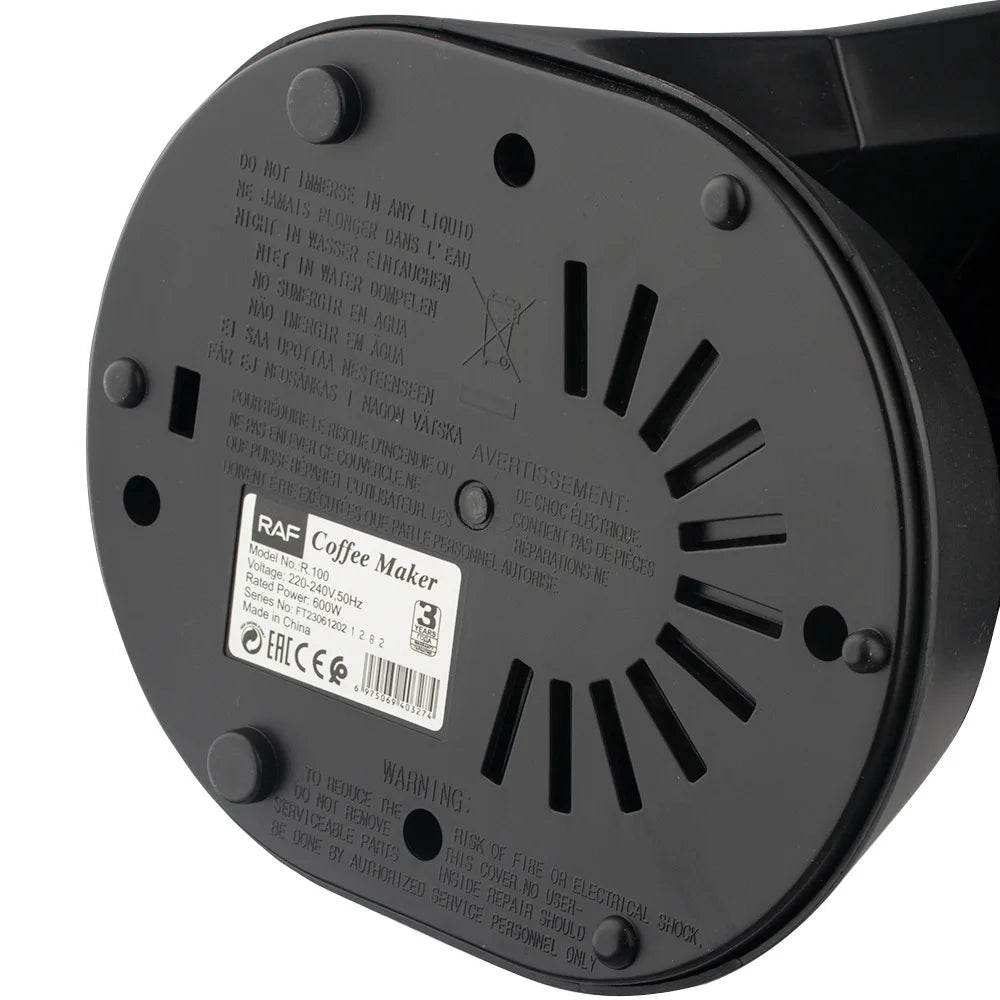 Bottom view of black RAF coffee maker model R.100 featuring 600W power specs and circular non-slip base design.