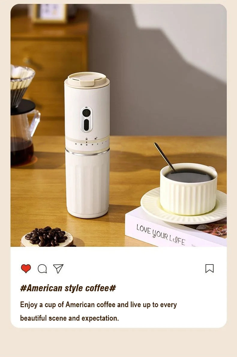 White portable electric coffee maker for Americano with ribbed design, standing next to a matching cup on a table.