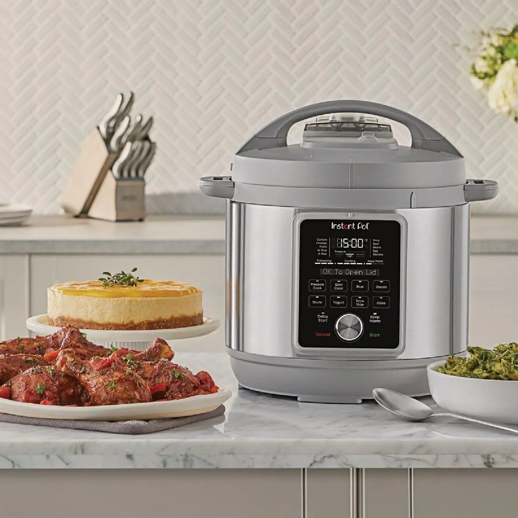 Instant Pot electric pressure cooker on countertop, open display and gray lid