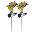 Two brass 360° garden sprinklers with black nozzles and metal stakes