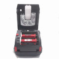 Barcode label printer cartridge bay part with red rollers, black housing