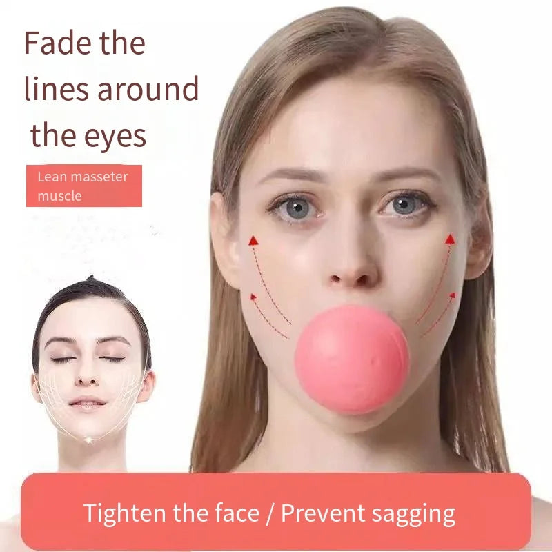 A woman using a round, pink silicone facial slimming exerciser held between her lips to tone facial muscles.