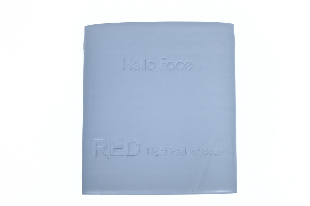 A large, rectangular, light blue Hello Face red light therapy mat for body use, shown folded against a white background.