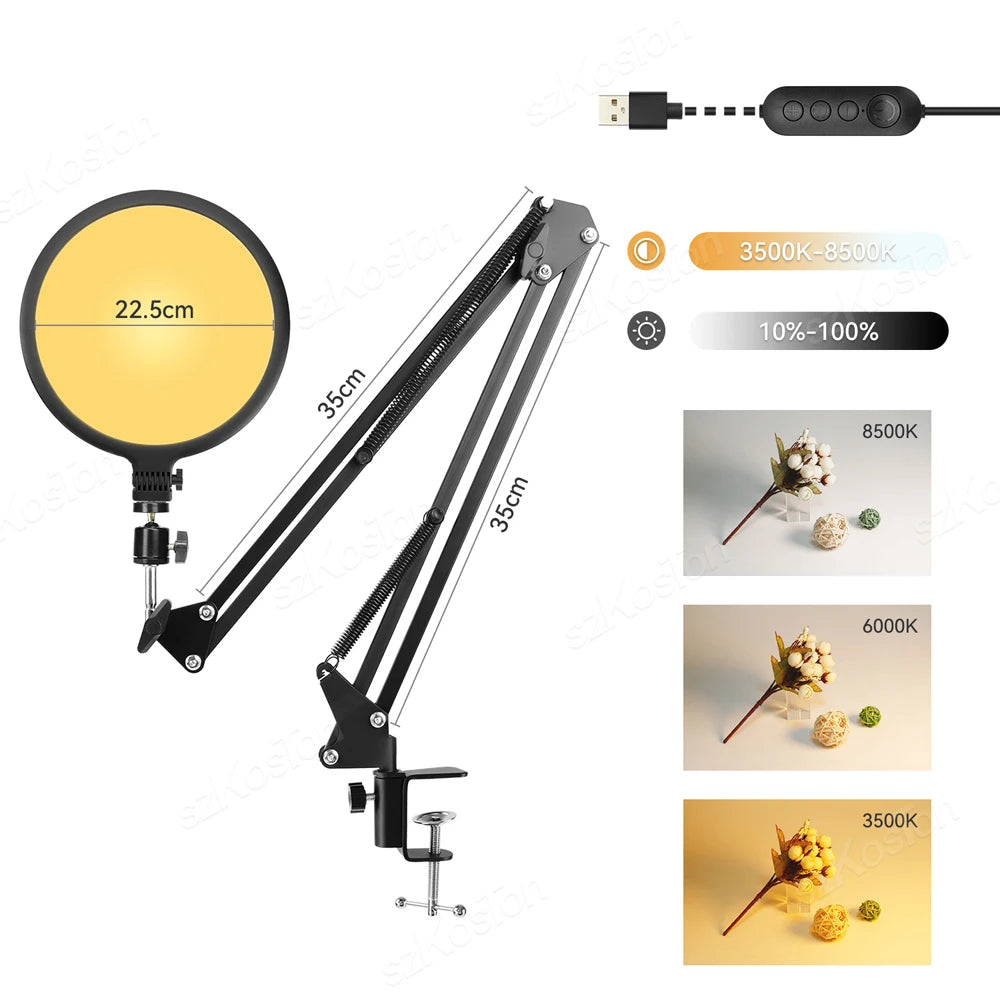 Black 22.5cm round LED ring light on an adjustable 35cm scissor arm stand with desk clamp for photography and streaming.