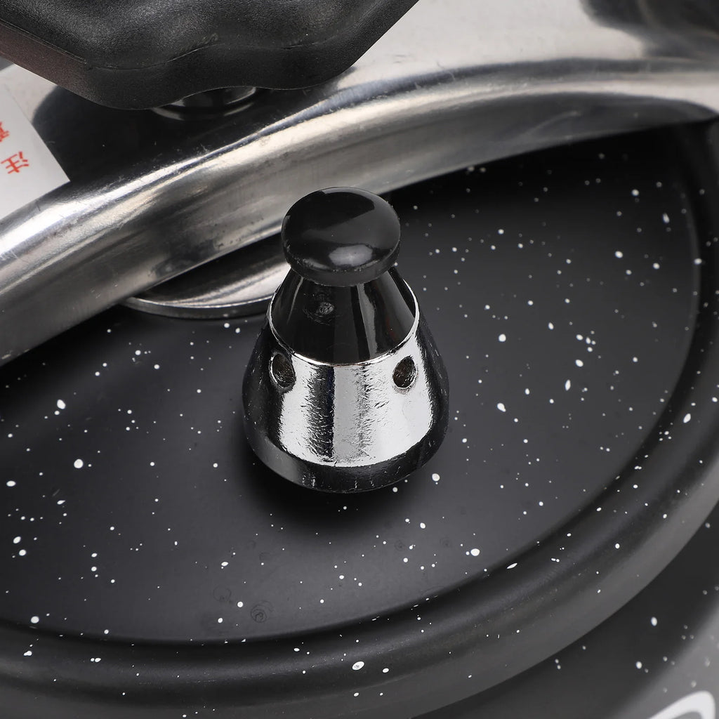 Black pressure canner valve with black cap on metal stem over speckled lid