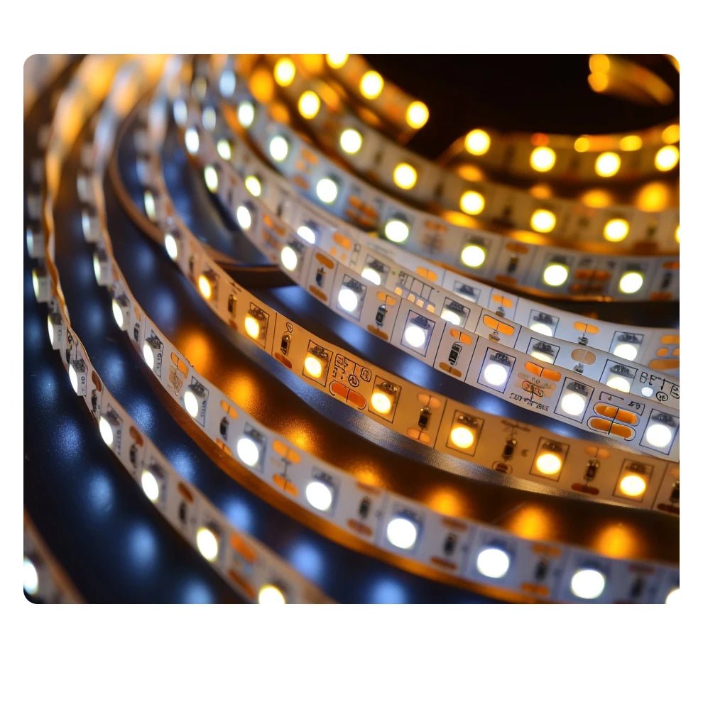 Flexible LED light strip coiled in a circle, featuring alternating warm yellow and cool white diodes on a white tape.