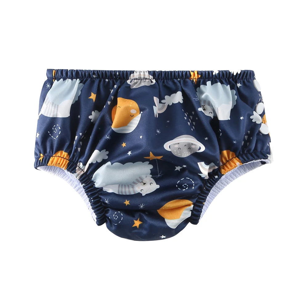 Reusable baby swim diaper in navy blue with adorable space, planet, and bear print design.