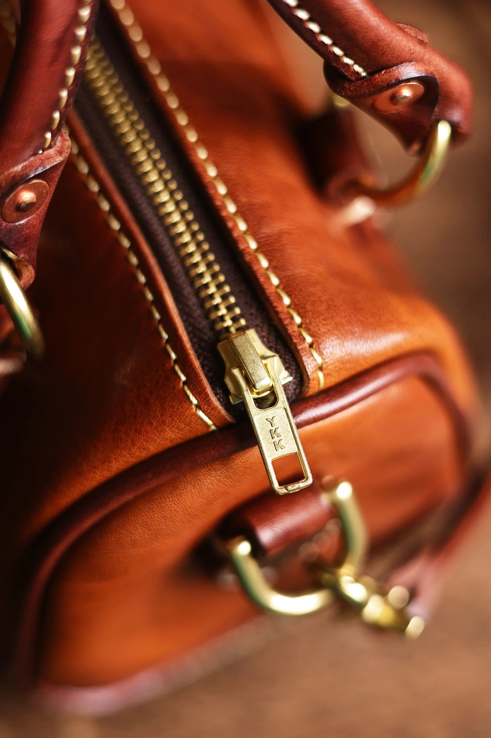 PNDME vintage small leather handbag in tan cowhide with brass hardware and high-quality YKK zipper closure.