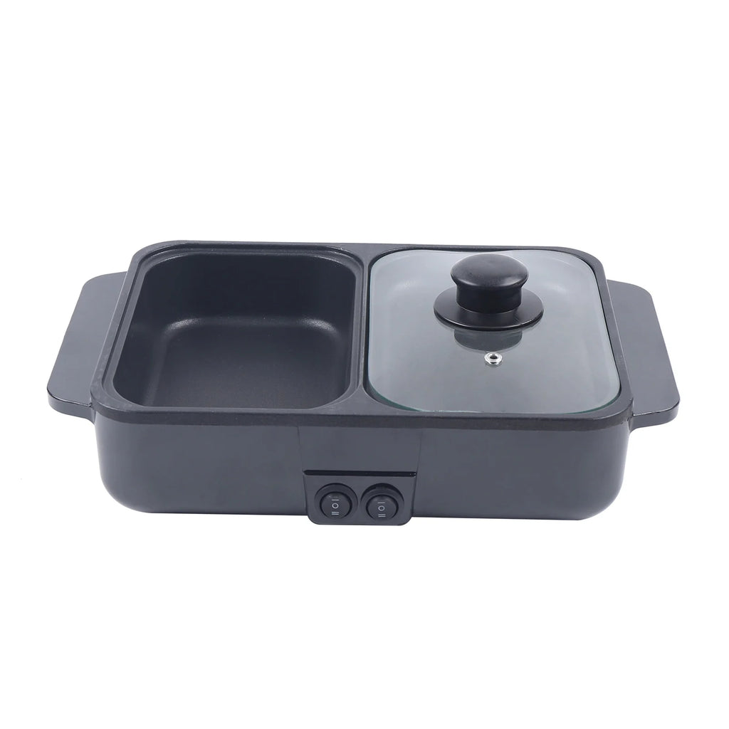 Black 2-in-1 hot pot and grill with glass lid over one side and dual nonstick basins