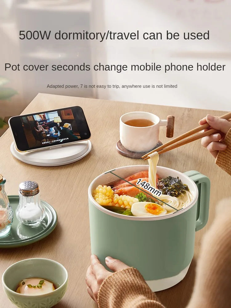 Electric hot pot cooker with mint-green pot and chopsticks meal, small tabletop use