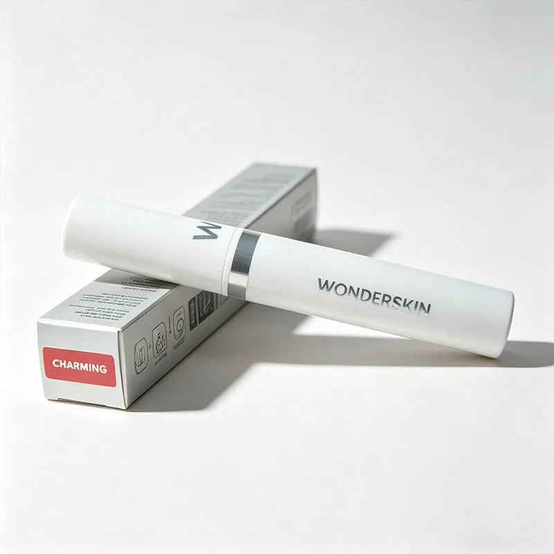 Wonderskin Charming peel-off lip stain tube and box, a long-lasting waterproof pink liquid lip tint on white background.