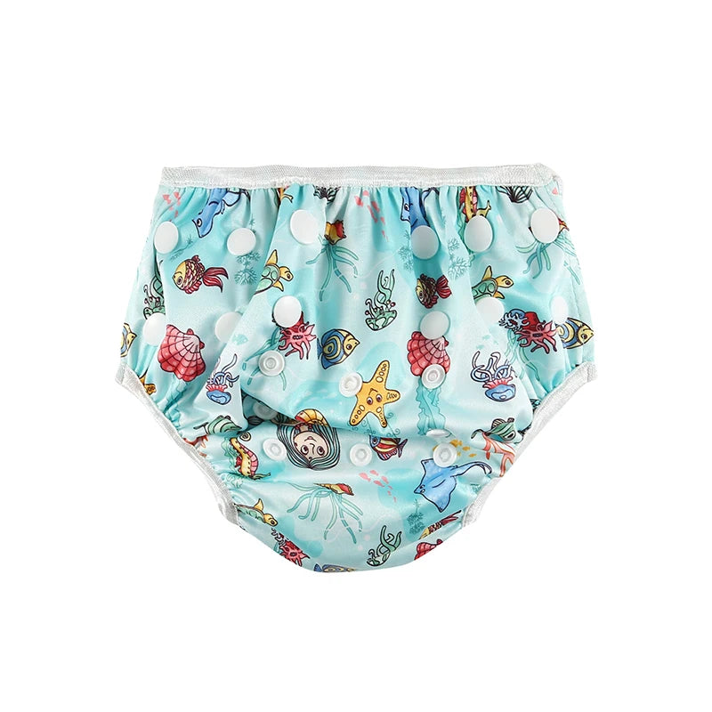 Reusable cloth swim diaper with ocean creature print, adjustable snap buttons for baby care.