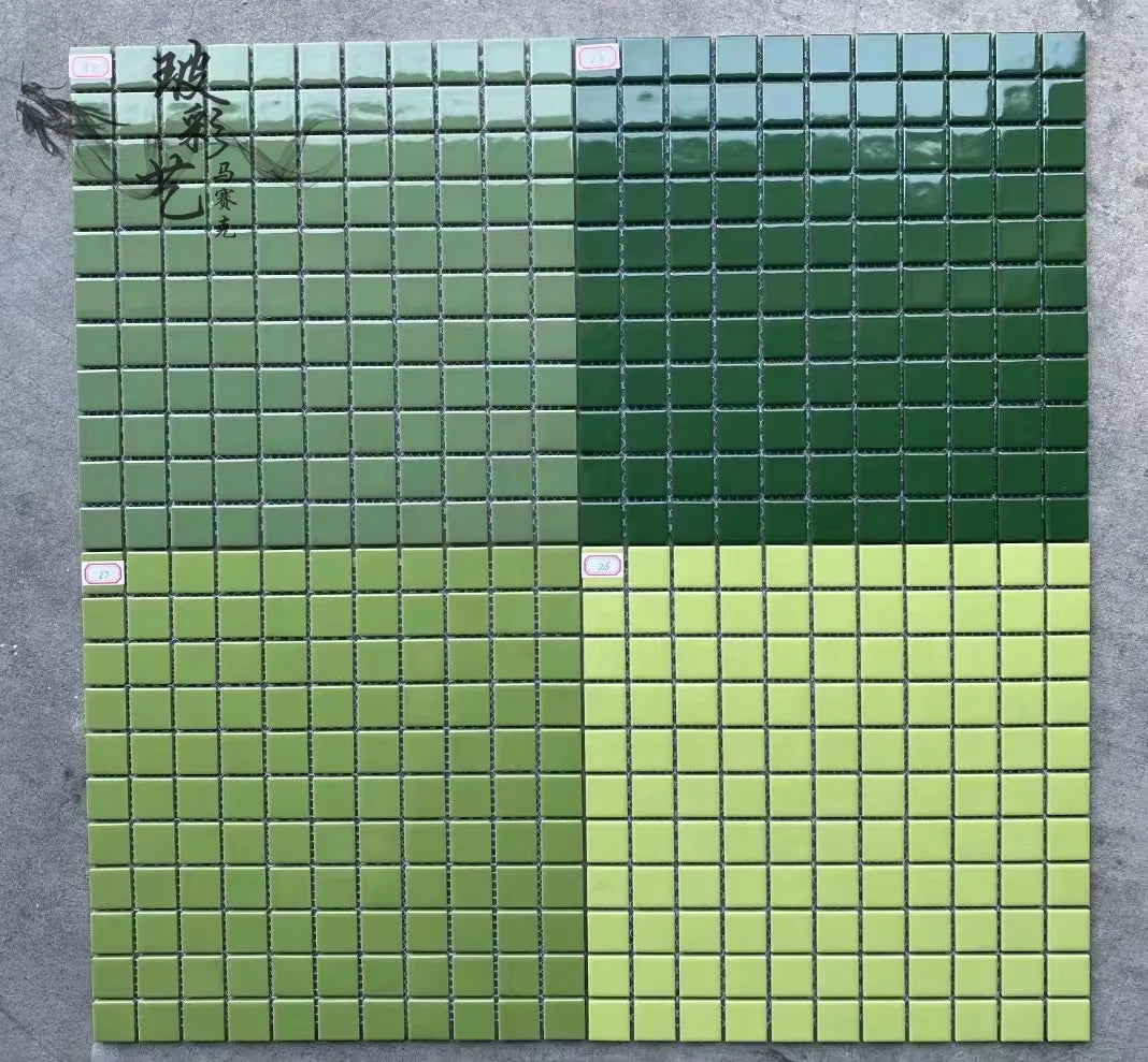 Ceramic mosaic tile sheet with green-to-yellow glossy square tiles on grid backing