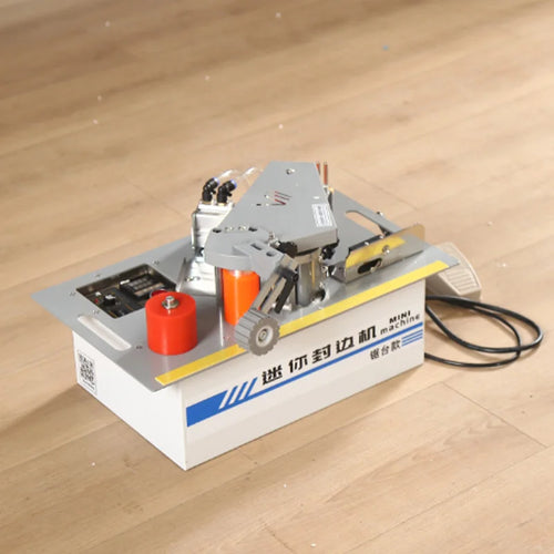 Mini edge banding machine with orange glue roller, control panel, and yellow guide strip