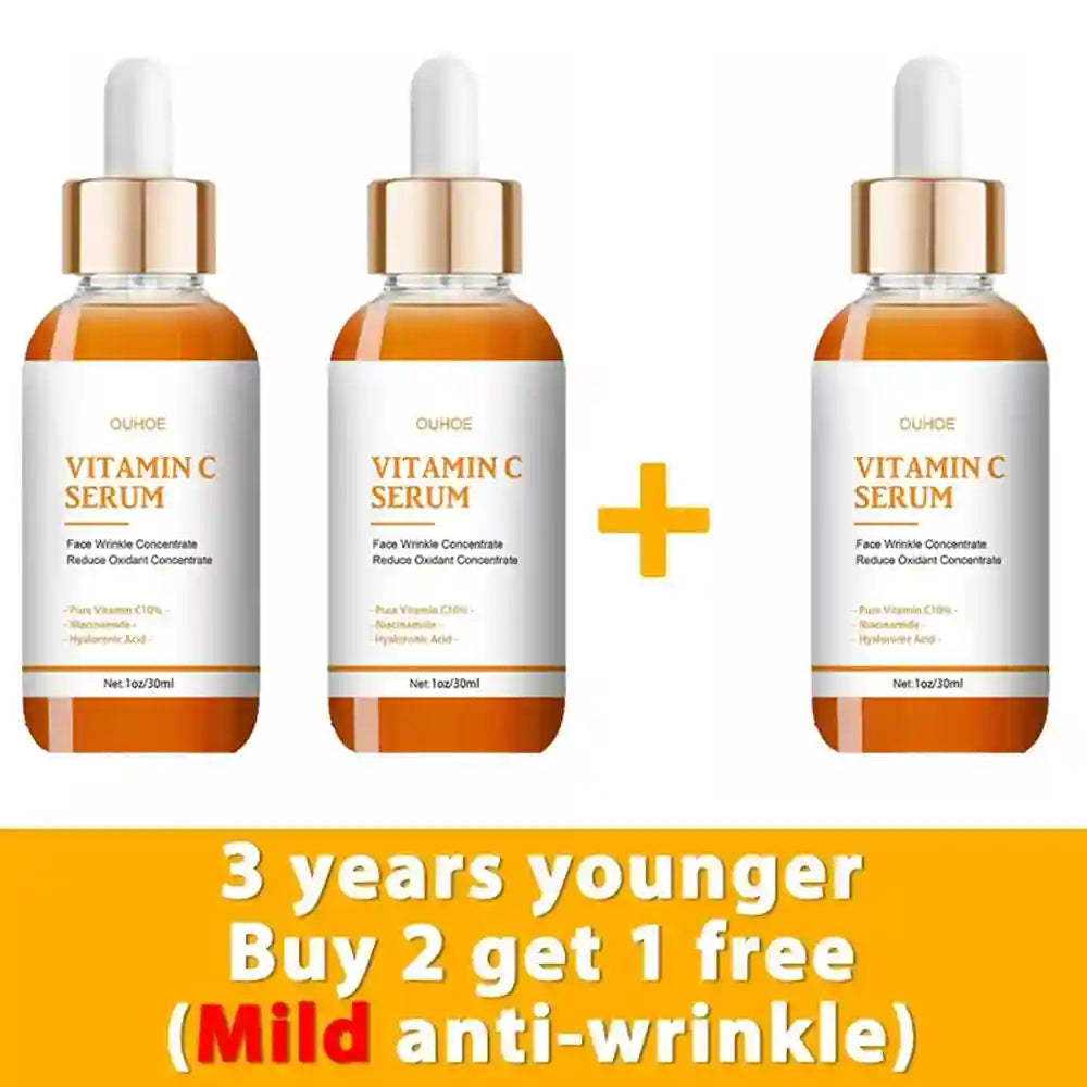 Three bottles of OUHOE Vitamin C serum with droppers, amber glass, and white labels against a yellow promotional banner.