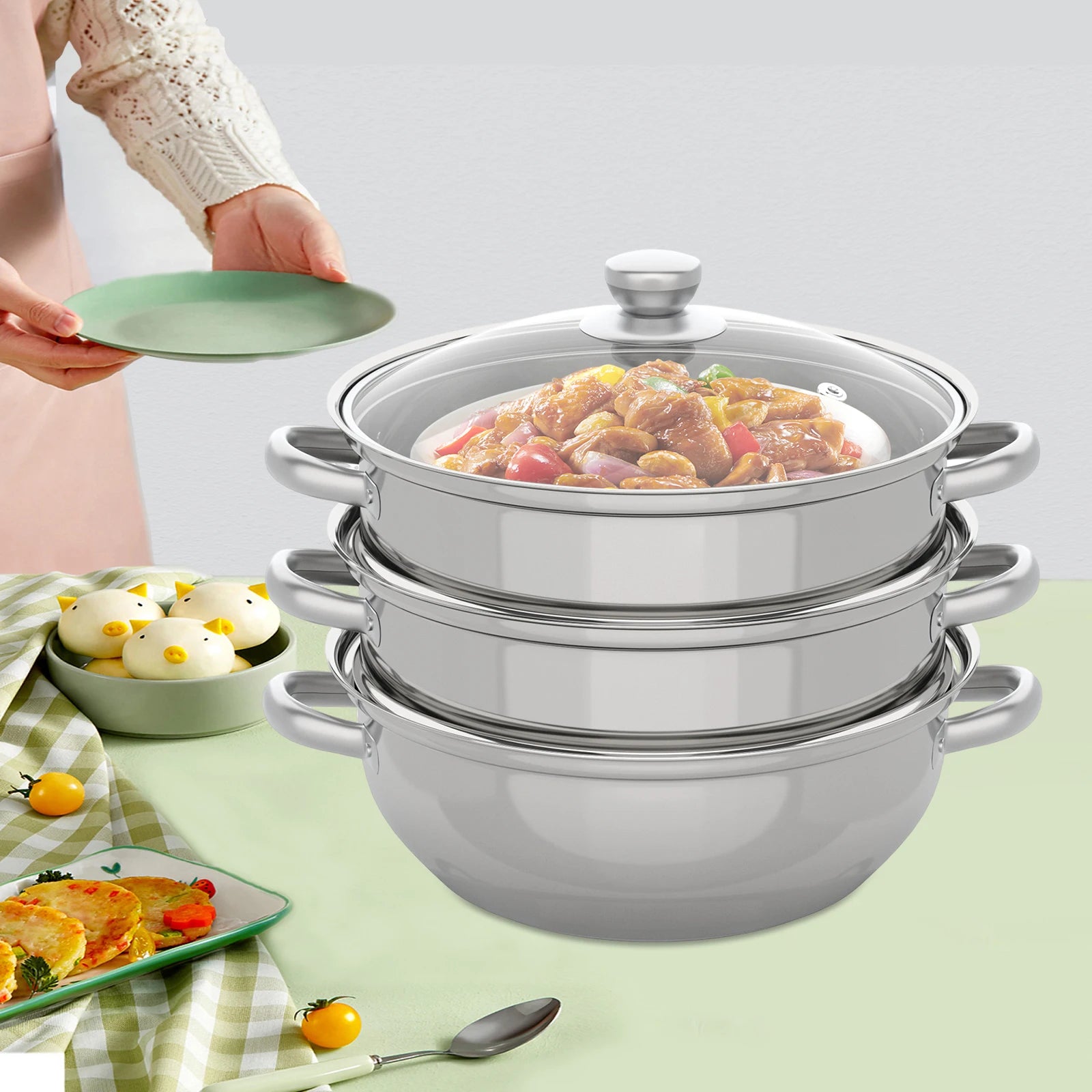 Stainless steel steamer pot with lid on table, hand lifting cover to add food.