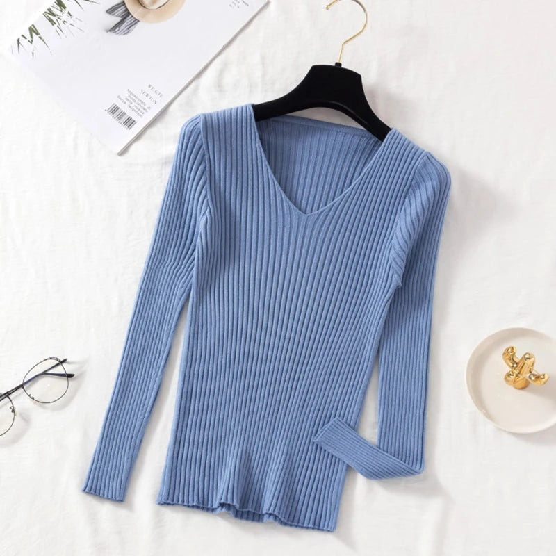 Tidesmit blue long-sleeve, ribbed knit sweater featuring a fitted silhouette and a classic V-neckline.