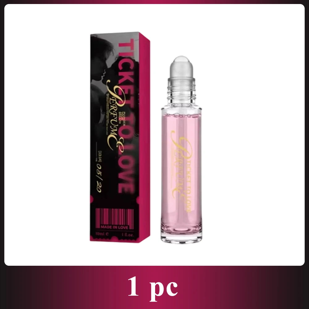 Ticket to Love roll-on perfume in a slender glass bottle with pink liquid, next to its pink and black rectangular box.