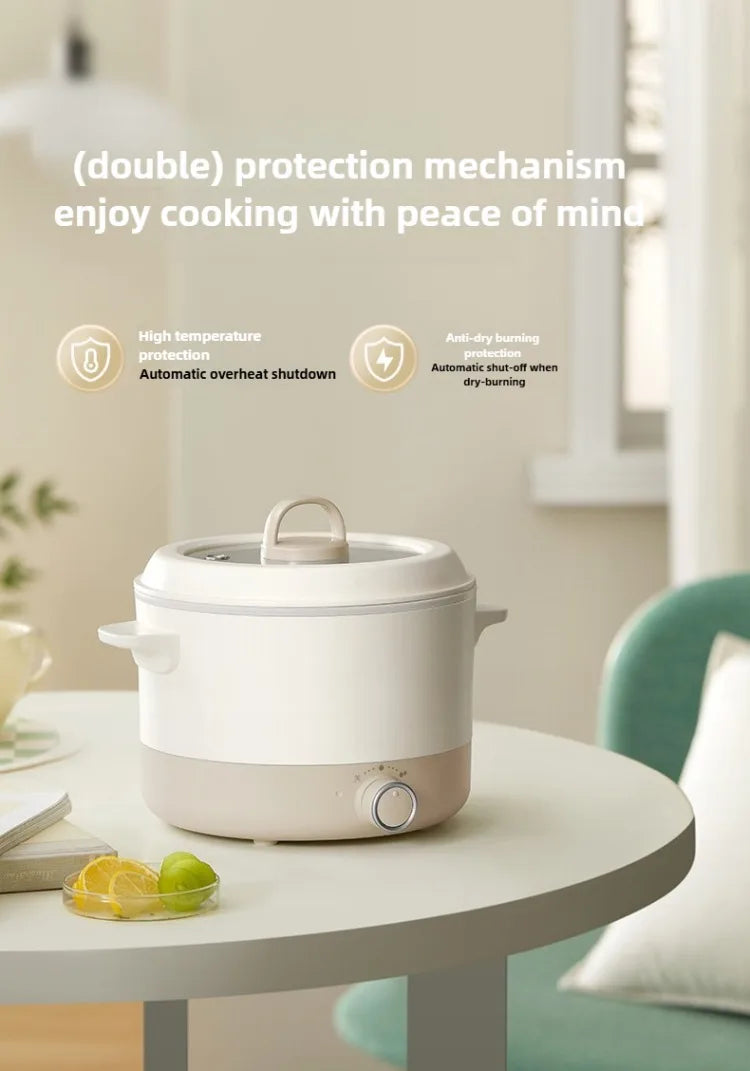 White countertop multi cooker with lid and handle on a kitchen table.