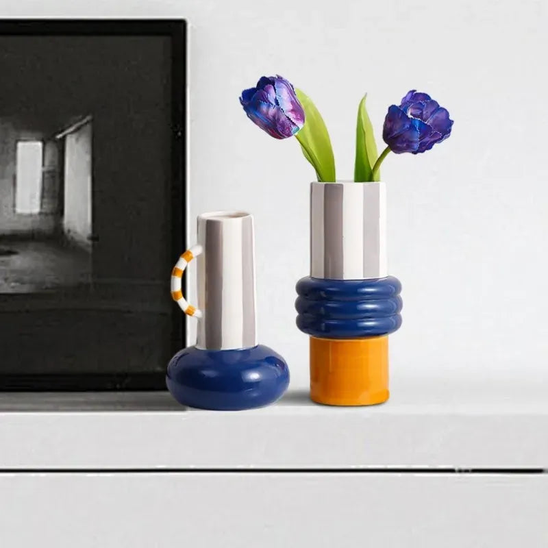 Ceramic patchwork vases with silver tops, blue necks, orange bases and purple tulips