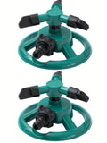 Green rotating lawn sprinkler nozzle with black outlets and hose connector