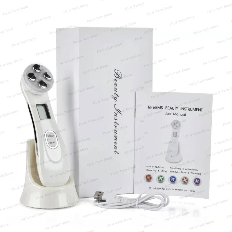 White EMS facial lifting device with five metal heads, charging base, USB cable, instruction manual, and product box.